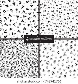 Set of four seamless simple hand drawn patterns in black and white colors. 