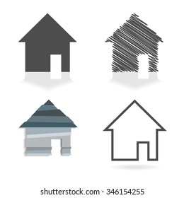 Set of four simple house symbols in grey colors.