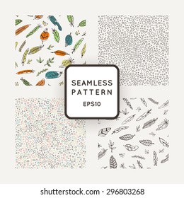 Set of four vector abstract seamless patterns made of feathers hand-painted