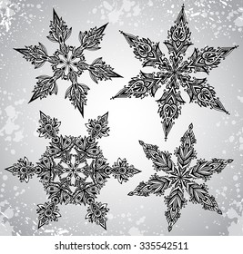 Set of four vector beautiful hand drawn ornamental doodle snowflakes