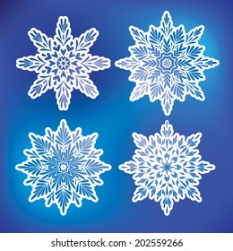 Set of four vector blue snowflakes. Christmas background