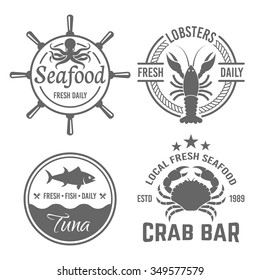 Set of four vector vintage labels, badges, emblems for seafood restaurant menu isolated on white background