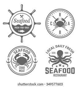 Set of four vector vintage labels, badges, emblems for seafood restaurant menu isolated on white background