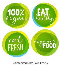 Set of four vegetarian labels with lettering. Healthy food stickers. 