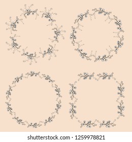 A set of four vintage openwork wreaths. Black and white vector hand drawing branches with leaves.  