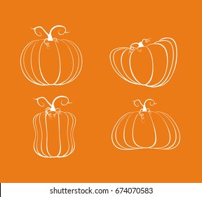 Set of four white pumpkins on an orange background