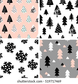 A set of four winter seamless repeat patterns with Christmas trees and snowflakes. Tiling festive background, greeting card or wrapping paper.