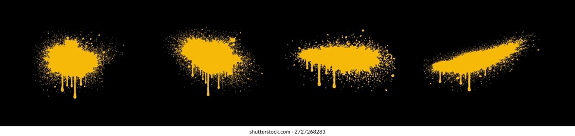 Set of four yellow spray paint splatters with dripping paint textures isolated on a solid black background.
