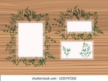 set of frame with laurel leafs wooden background