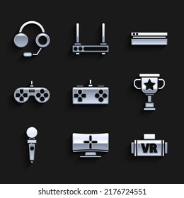 Set Gamepad, Computer monitor, Virtual reality glasses, Award cup, Joystick for arcade machine, Video game console and Headphones icon. Vector