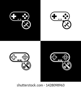 Set Gamepad with screwdriver and wrench icon isolated on black and white background. Adjusting, service, setting, maintenance, repair, fixing.  Vector Illustration