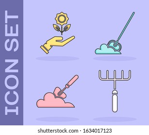Set Garden rake, Hand holding flower, Garden trowel spade or shovel in the ground and Shovel in the ground icon. Vector