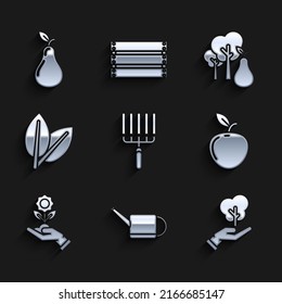 Set Garden rake in work, Watering can, Tree hand of environmental protection, Apple, Hand holding flower, Leafs, with pears and Pear icon. Vector