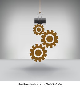 A Set of Gears Hung by a Binder Clip