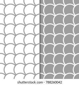 Set of geometric ornaments. Gray and white seamless patterns