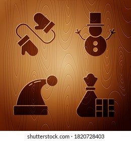Set Gift box and bag, Pair of knitted christmas mittens, Christmas Santa Claus hat and Christmas snowman on wooden background. Vector