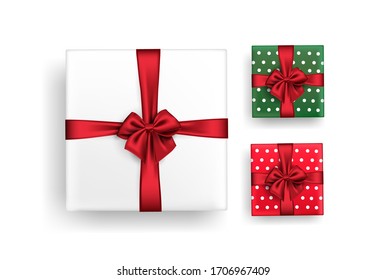 A set of gift boxes tied with red ribbon. Isolated vector stock image on a white background of white, red and green polka dot packages. Elements or clip art for the design of postcards or banners