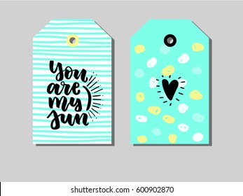 Set of Gift Tags about love with quote You are my sun. In blue, white, black and yellow colors. Perfect for holiday greetings
