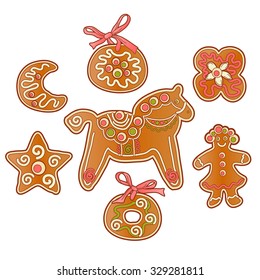 Set of gingerbread cookies with icing, isolated on white background.
