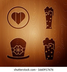 Set Glass of beer, Heart and Happy Saint Patrick day, Leprechaun hat and four leaf clover and Glass of beer on wooden background. Vector