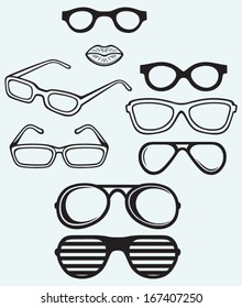 Set glasses and lips silhouettes isolated on blue background