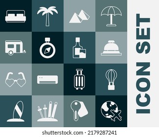 Set Globe with flying plane, Hot air balloon, Hotel service bell, Egypt pyramids, Compass, Rv Camping trailer, room bed and Whiskey bottle and glass icon. Vector