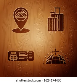Set Globe with flying plane, Map pointer with Egypt pyramids, Cruise ticket for traveling by ship and Suitcase for travel on wooden background. Vector