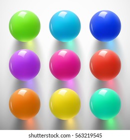 Set of glossy colored balls on white background. Glass sphere with shiny blik. Vector illustration.