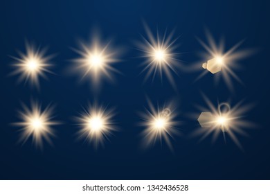 Set of Glowing Light Stars with Sparkles. Golden Light effect. Vector Illustration