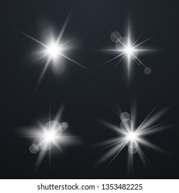 Set of Glowing Light Stars with Sparkles. Light effect. Vector Illustration...