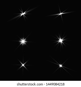 
Set of glowing stars on a black and gray background