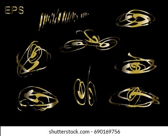 Set gold artistic textures. Brush strokes isolated on black background.