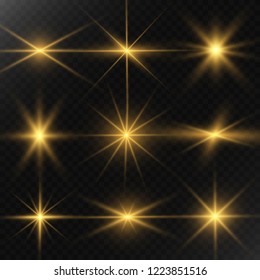 Set of gold bright beautiful stars. Light effect Bright Star. Beautiful light for illustration. Christmas star. White sparks sparkle with a special light. Vector sparkles on transparent backgroun