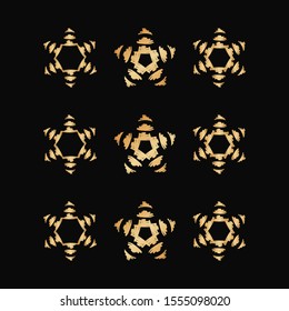 Set of gold brush stroke snowflake or star icon on black background. Symbol of winter, cold and holidays. Simple winter elements for events, cards, wrapping paper and print. Golden vector illustration