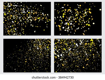 Set of gold glitter explosion on black background. Golden festive blow texture of confetti collection. Golden grunge grainy spray abstract texture on black background. Holiday background.