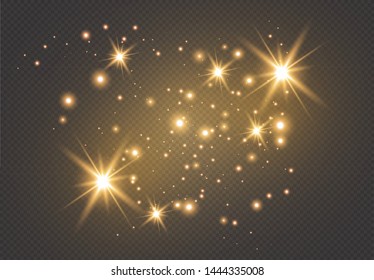 Set of gold glowing light effects isolated on dark background. Glow light effect. Star exploded sparkles.