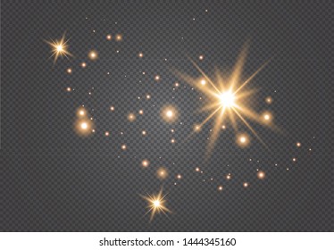 Set of gold glowing light effects isolated on dark background. Glow light effect. Star exploded sparkles.