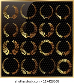 Set from gold laurel wreath on the black background