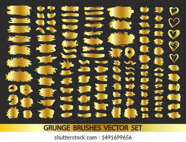 Set of gold paint, ink brush strokes, brushes, lines. Dirty artistic design elements, boxes, frames for text. Vector illustration.