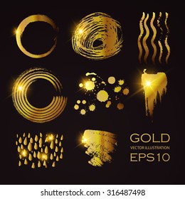 Set of gold paint stains. Hand drawn elegant art design. Vector illustration