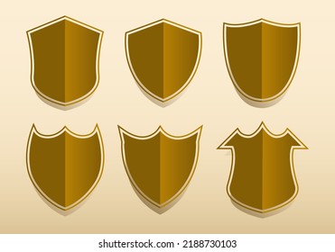 Set of gold shields of various shapes. Vector illustration