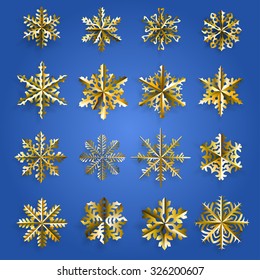 Set of gold snowflakes cut out of paper