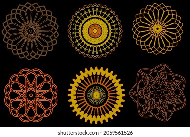 set of gold  snowflakes or floral design elements. Isolated on black background.