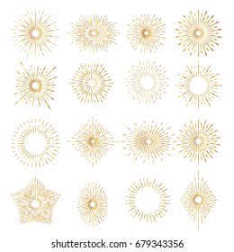 Set of gold sunburst rays design elements.