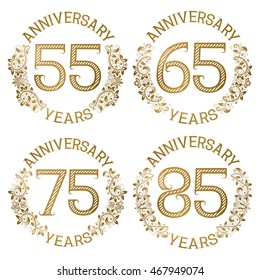 Set of golden anniversary emblems. Fifty fifth, sixty fifth, seventy fifth, eighty fifth years signs in vintage style.