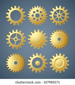 Set of golden differently shaped cogwheels