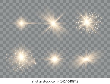Set of golden glowing lights effects isolated on transparent background. Sun flash with rays and spotlight. Special effect isolated on transparent background.