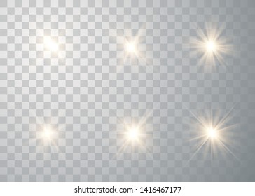Set of golden glowing lights effects isolated on transparent background. Sun flash with rays and spotlight. Special effect isolated on transparent background.