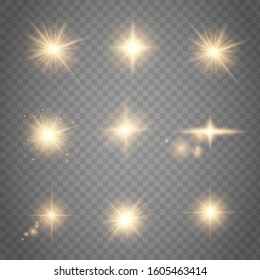 Set of golden glowing lights effects existing on a transparent background.  Abstract special effect element design. Shine ray, sparkling round.  Bright gold flashes and glares. Bright rays of light. 
