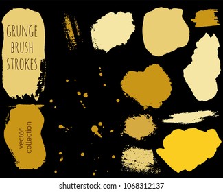 Set of golden ink vector stains. Grunge brush collection isolated on black